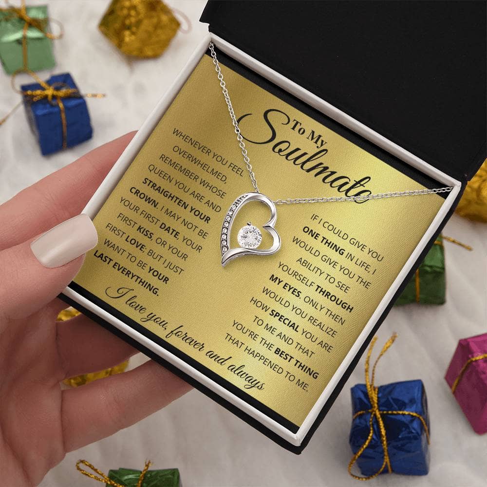 Alt text: "A hand holding the Forever Love Customized Soulmate Necklace in a luxurious gift box with LED lighting"