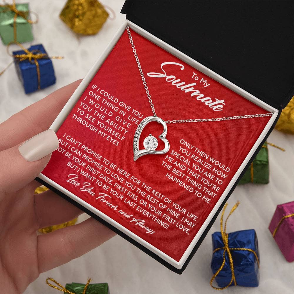 Alt text: "A hand holding the Forever Love Necklace in a box, symbolizing enduring love and commitment. Personalized Soulmate Necklace, a tangible token of love and connection."