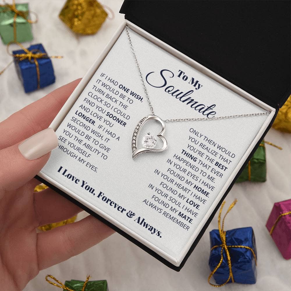 Alt text: "A hand holding the Forever Love Necklace for My Soulmate in a luxurious gift box with LED lighting."
