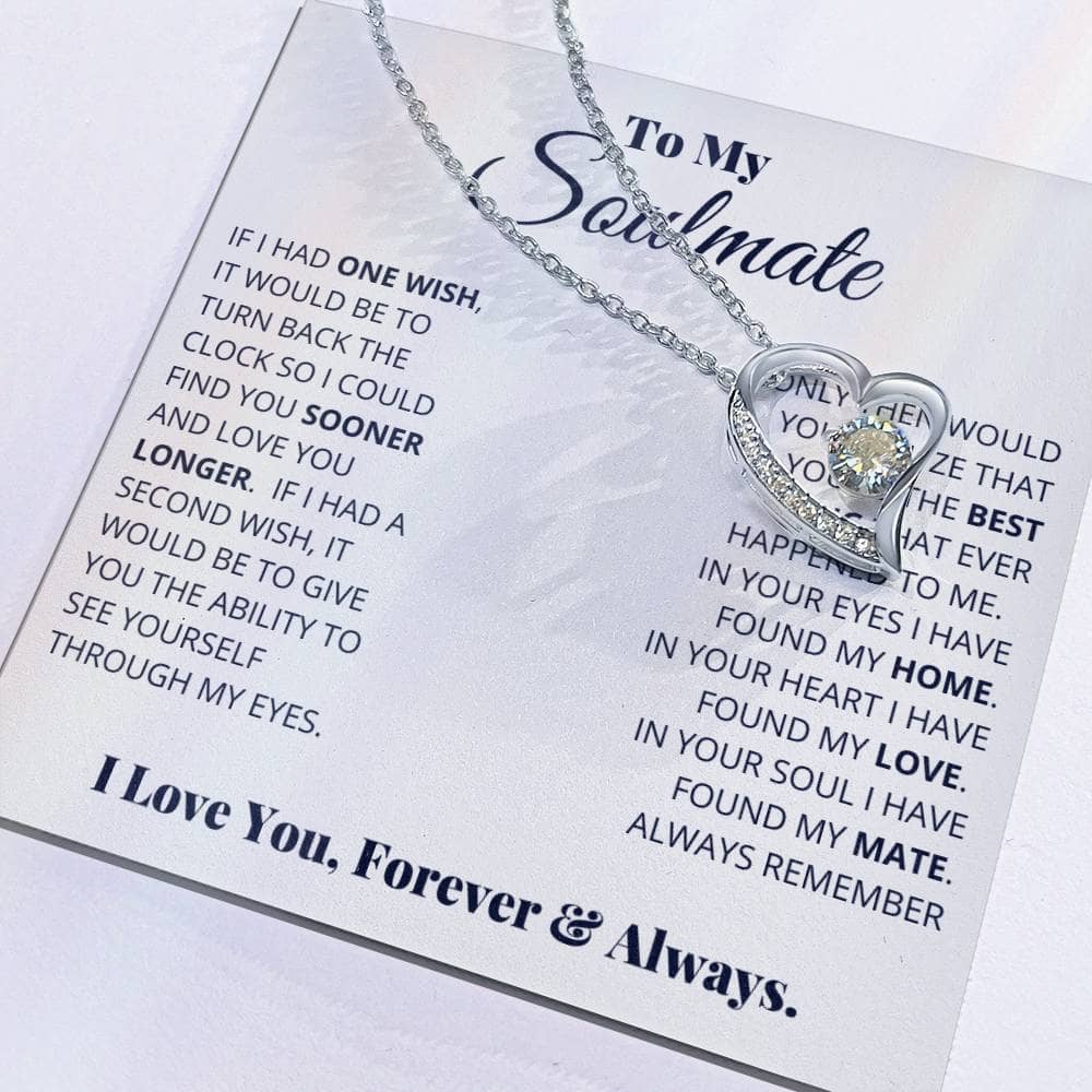 Alt text: "Close-up of heart-shaped Forever Love Necklace on card, symbolizing eternal love and soulmate connection."