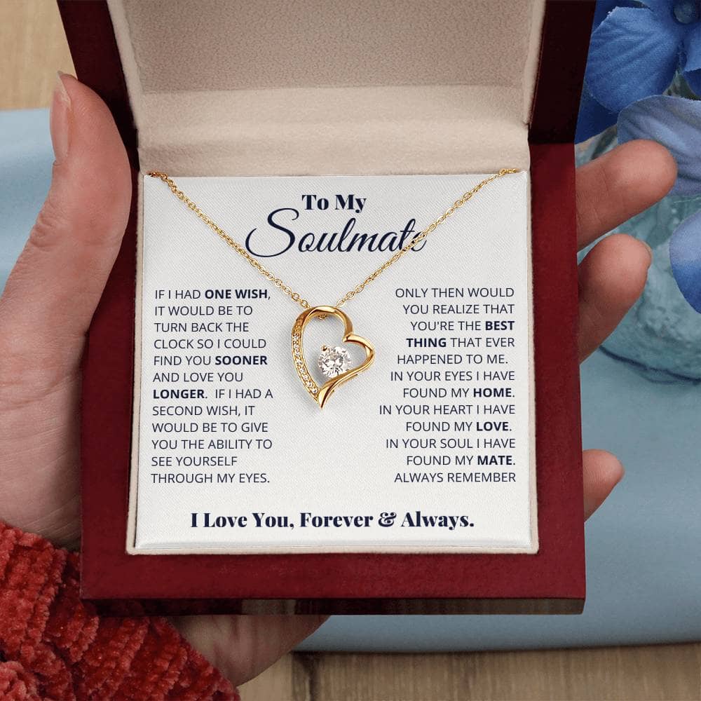 A hand holding a Forever Love Necklace for My Soulmate in a box, symbolizing eternal love and a unique love story.