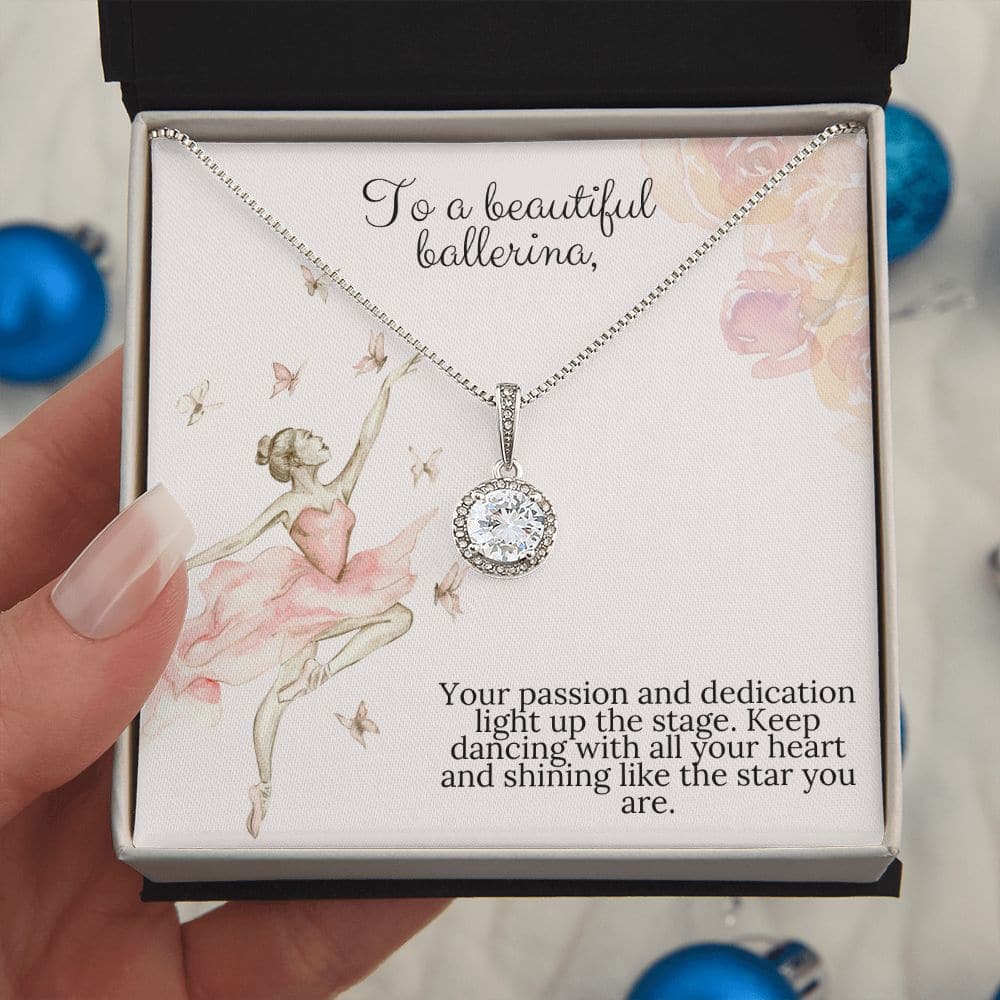 Alt text: "A hand holding the Forever Treasured Necklace Set in a box"