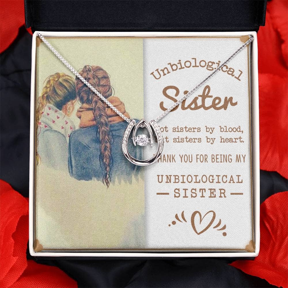 Alt text: "Heartfelt Unbiological Sisters Custom Necklace - Silver pendant on chain with cubic zirconia, symbolizing unbreakable bond and sisterhood."