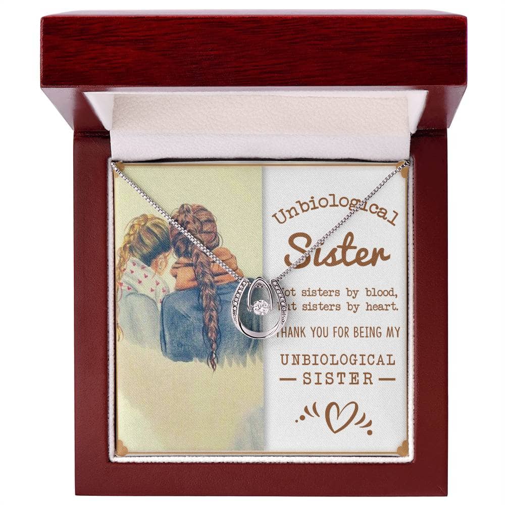 Alt text: "Personalized Unbiological Sisters Necklace - Two girls holding a necklace, symbolizing the unbreakable bond of sisterhood."