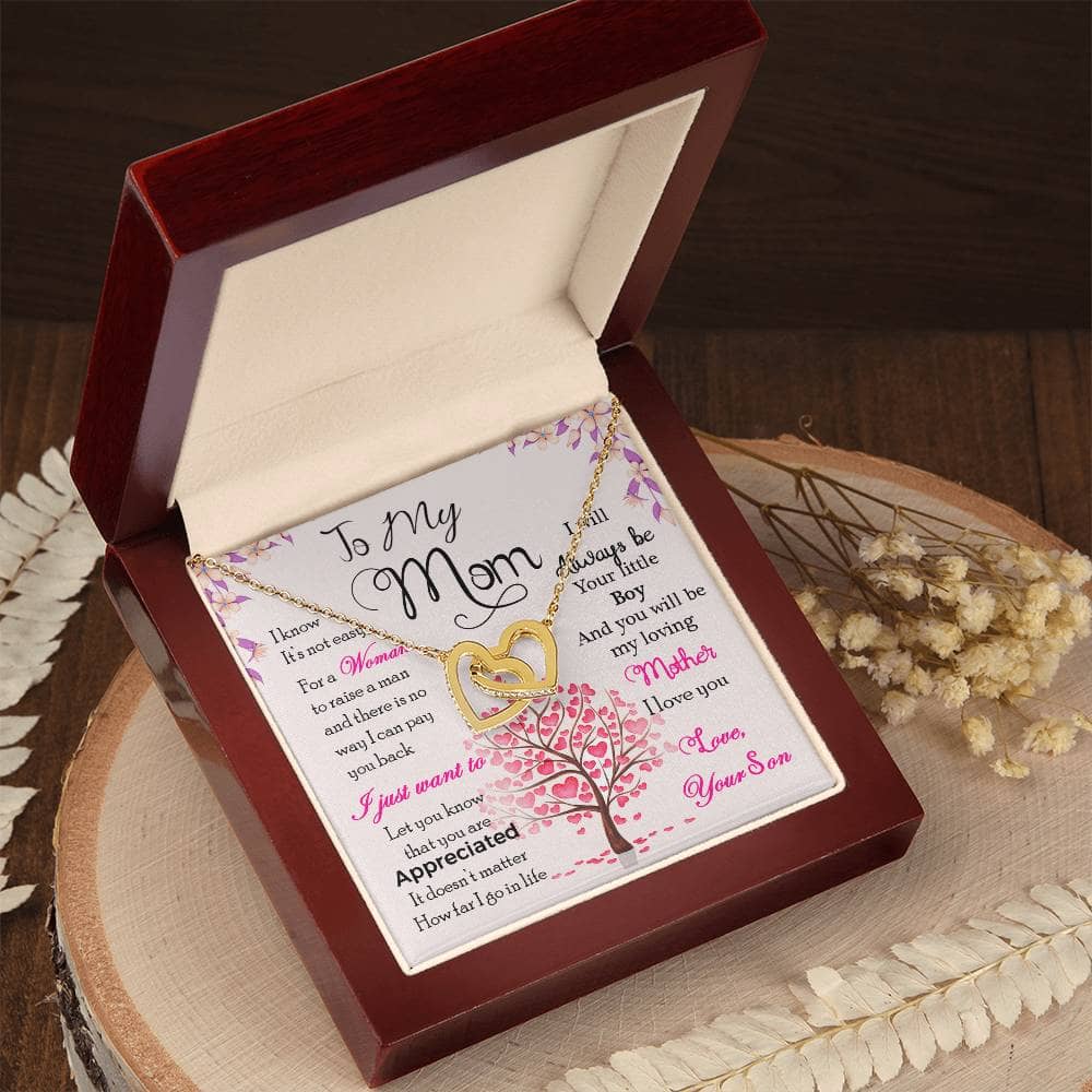 alt: "A high-quality personalized mother necklace in a box, adorned with cushion-cut cubic zirconia, symbolizing the everlasting bond between a mother and her child. Presented in an elegant mahogany-style gift box with LED lighting."