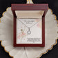 Alt text: "Iconic Personalized Daughter Necklace in a luxurious mahogany-style box with LED lighting"