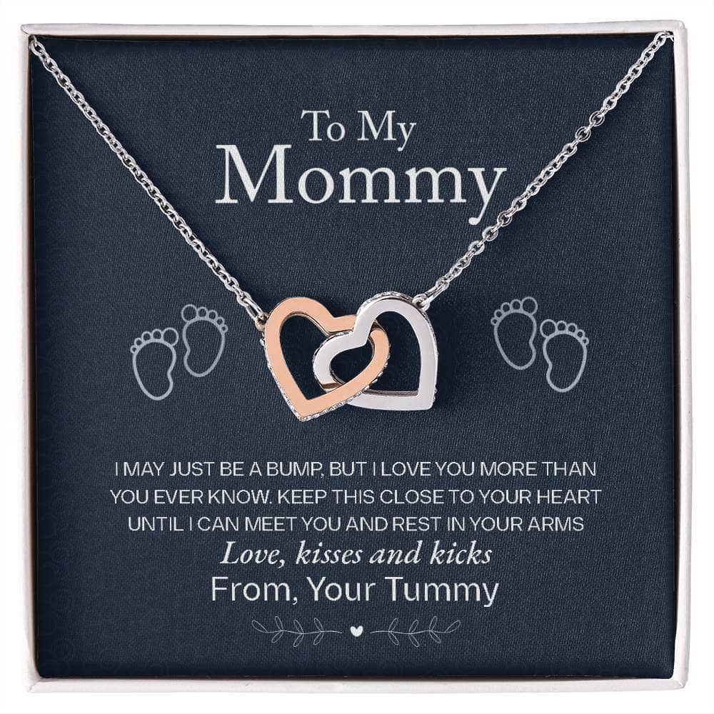 Alt text: "Interlocking Hearts Necklace - A necklace in a box, featuring two heart-shaped pendants adorned with cubic zirconia crystals. Symbolizing the eternal love between a mother and child. Perfect personalized mother necklace gift."