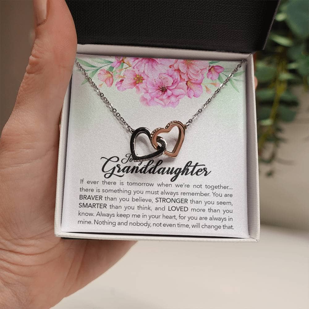 Alt text: "Interlocking Hearts Personalized Granddaughter Necklace in a box, showcasing a hand holding the necklace, symbolizing the eternal bond between grandparents and granddaughters."