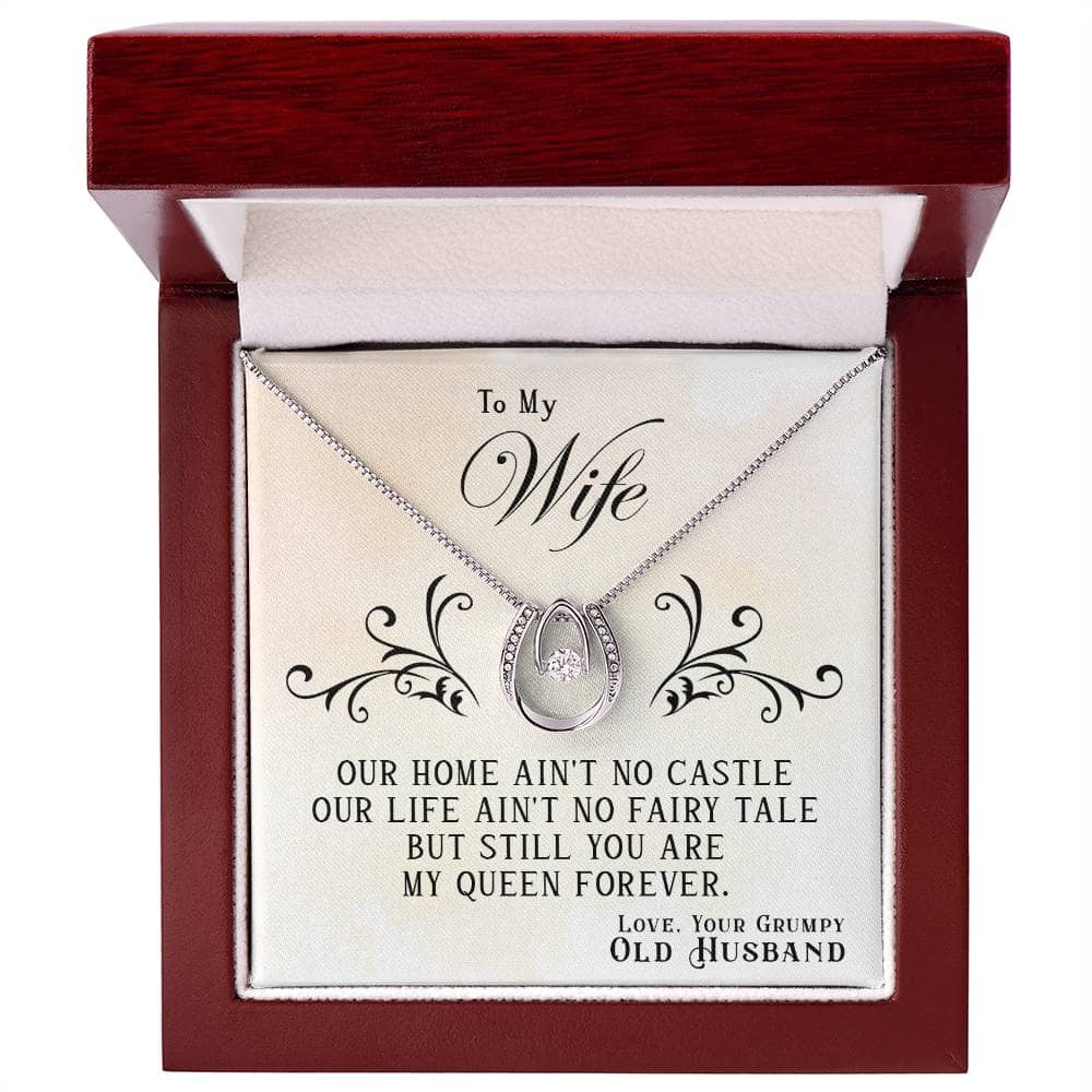 Alt text: "Luxurious personalized wife necklace in a mahogany-styled box with a heart-shaped pendant and sparkling cubic zirconia, symbolizing love and unity."