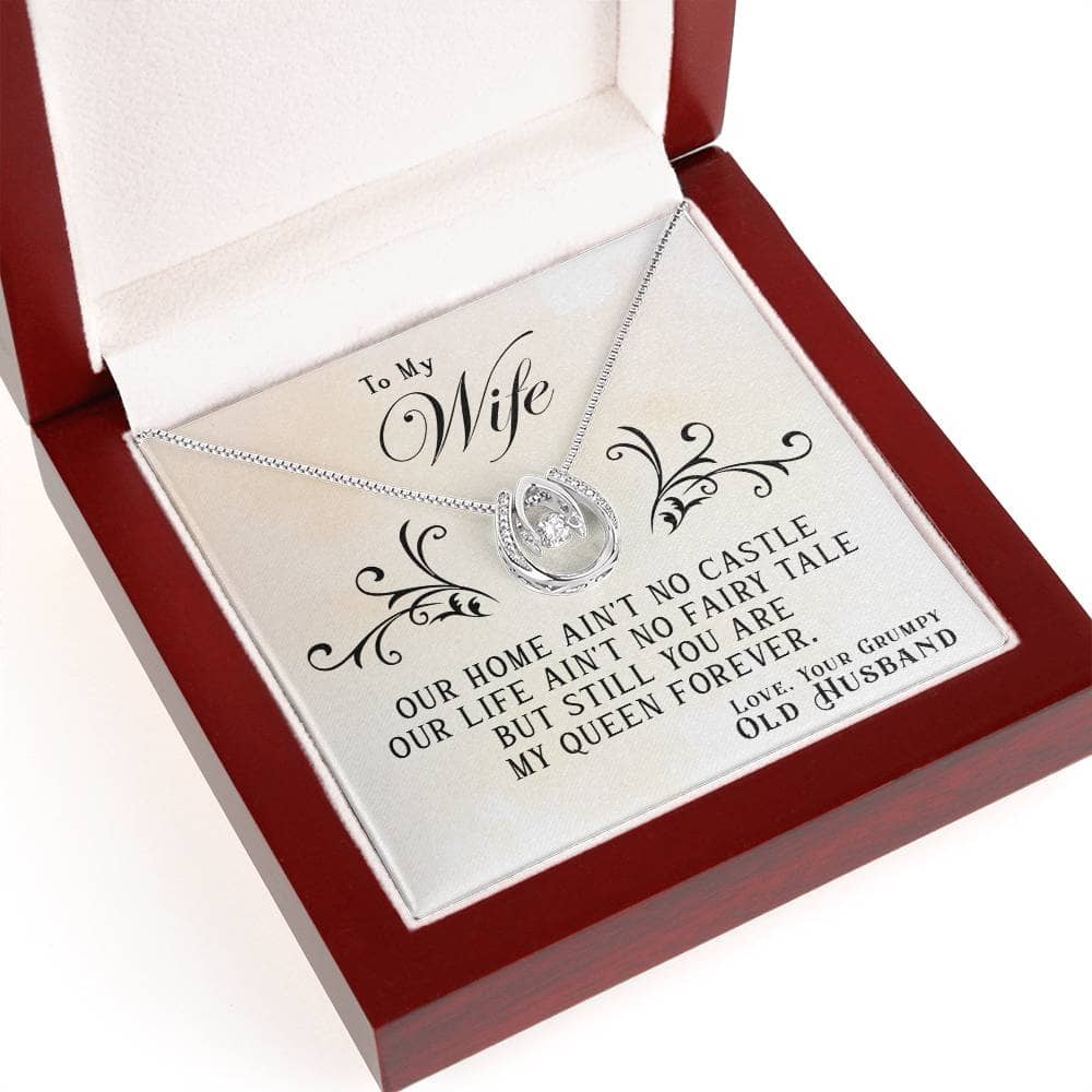 Alt text: "Luxurious personalized wife necklace in a mahogany box with heart-shaped pendant and sparkling cubic zirconia."