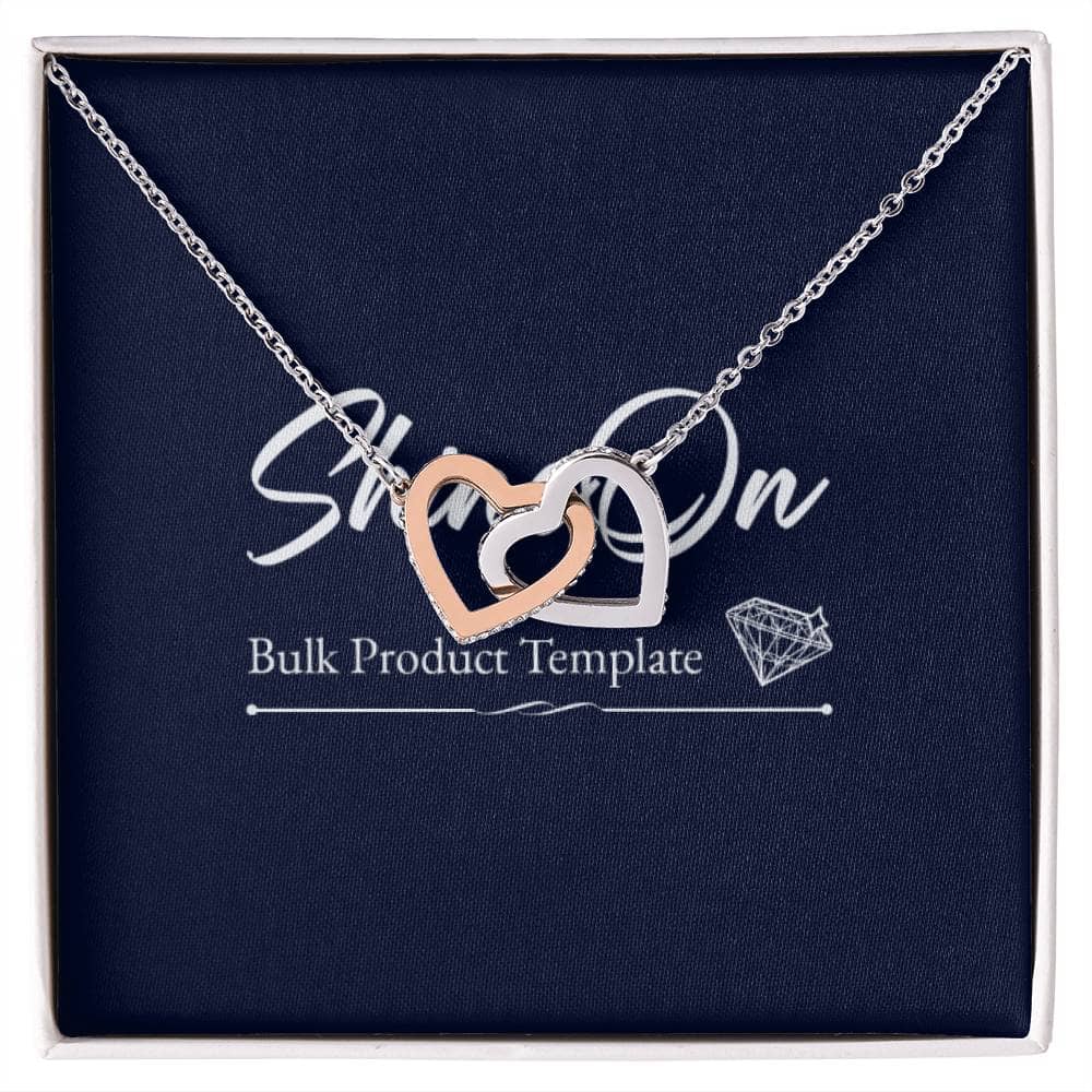 A necklace in a box featuring two heart pendants embellished with CZ crystals. Symbolize your never-ending love with this Interlocking Hearts necklace, perfect for everyday wear. Adjustable length and high-quality finish.