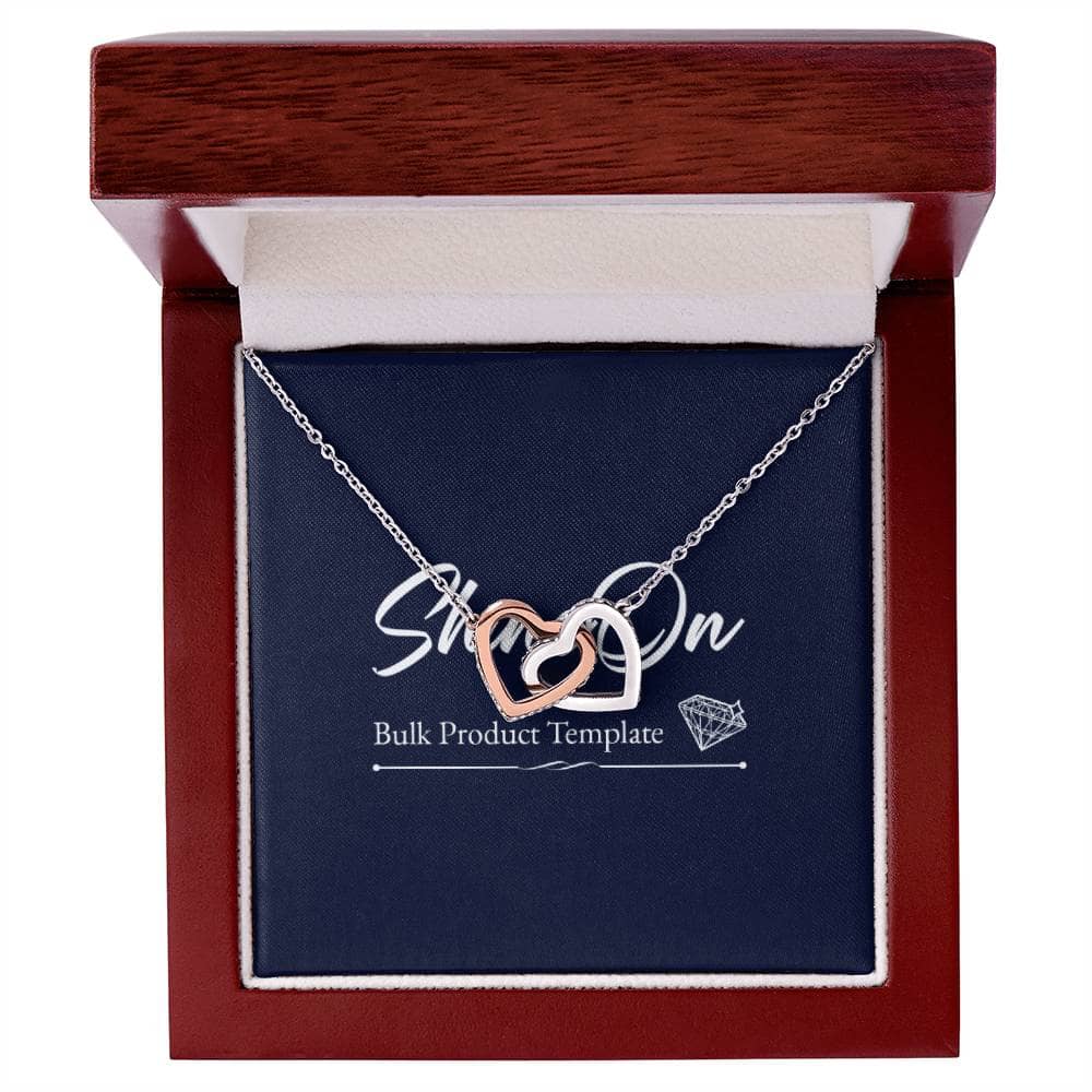 Alt text: "Interlocking Hearts necklace with CZ crystals in a box, symbolizing never-ending love. Perfect accessory for everyday wear. Pendant dimensions: 0.6" height / 1.1" width. Adjustable length: 18" - 22". Lobster clasp."