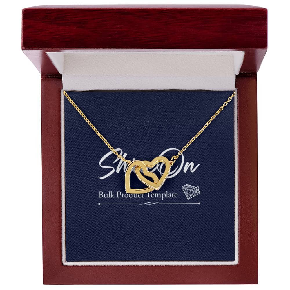 A gold heart necklace in a box, featuring two lovely hearts embellished with CZ crystals. The perfect accessory for everyday wear, symbolizing never-ending love.
