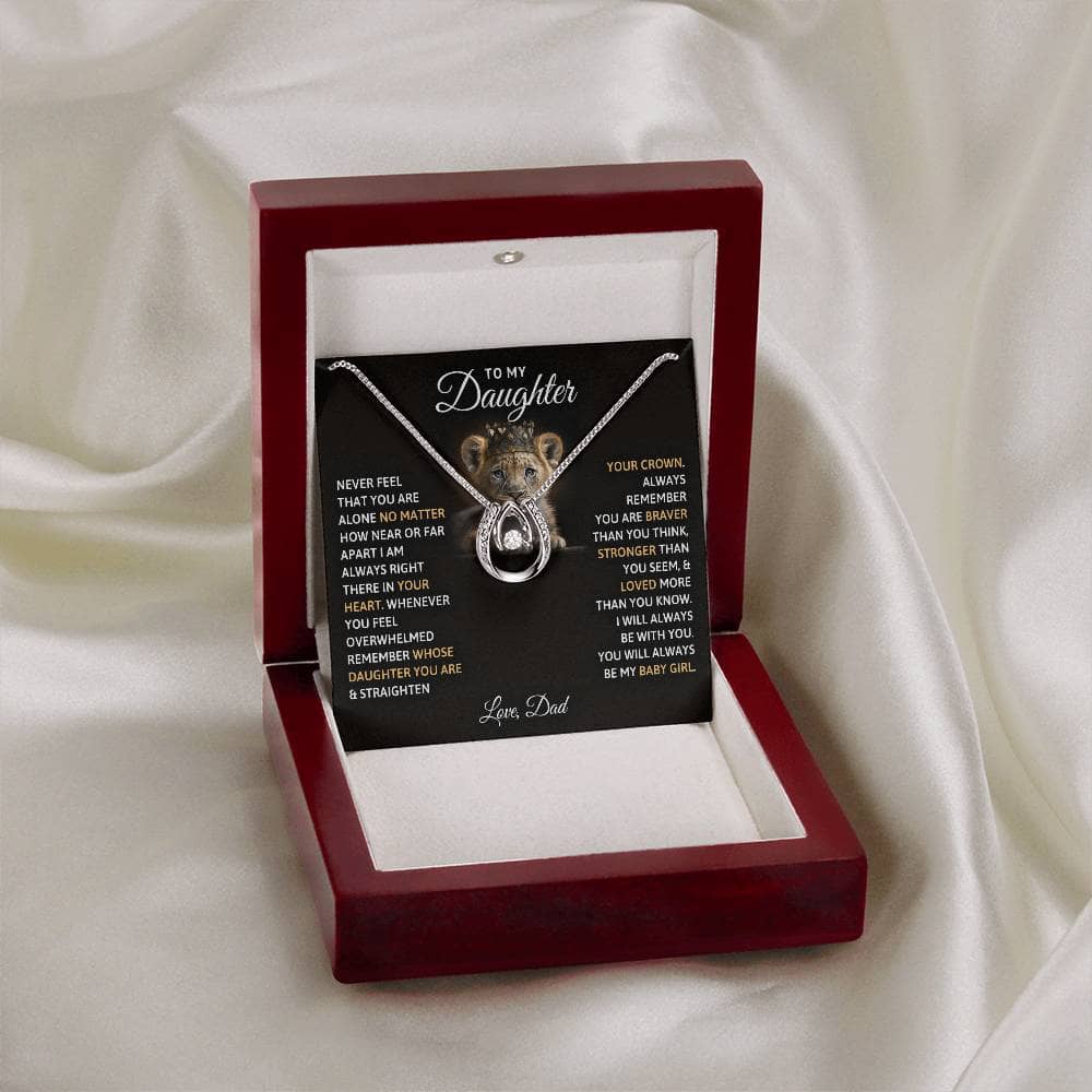 Alt text: "Personalized Daughter Necklace: Always My Baby Girl - A heart-shaped pendant necklace in a box, featuring a radiant cushion-cut cubic zirconia. Crafted with love and presented in a mahogany-styled luxury box with LED lights. Perfect for gifting on birthdays, graduations, and special occasions. Made with genuine white gold over stainless steel. Adjustable chain length from 16" to 18". Hypoallergenic and safe for sensitive skin. Worldwide shipping available. From Bespoke Necklace."