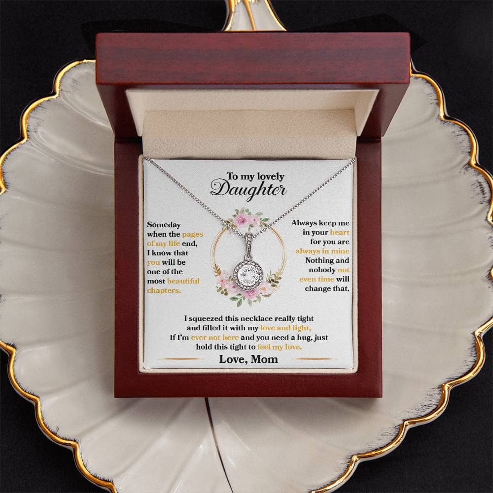 A necklace in a mahogany-style box with LED lighting, symbolizing an unbreakable bond between parent and daughter.