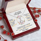 Alt text: "Personalized Daughter Necklace in a box with a note and red berries, symbolizing eternal love and unbreakable bonds."