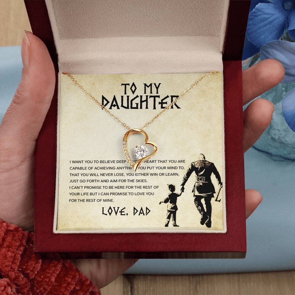 Alt text: "Hand holding Personalized Daughter Necklace with heart-shaped pendant in box"