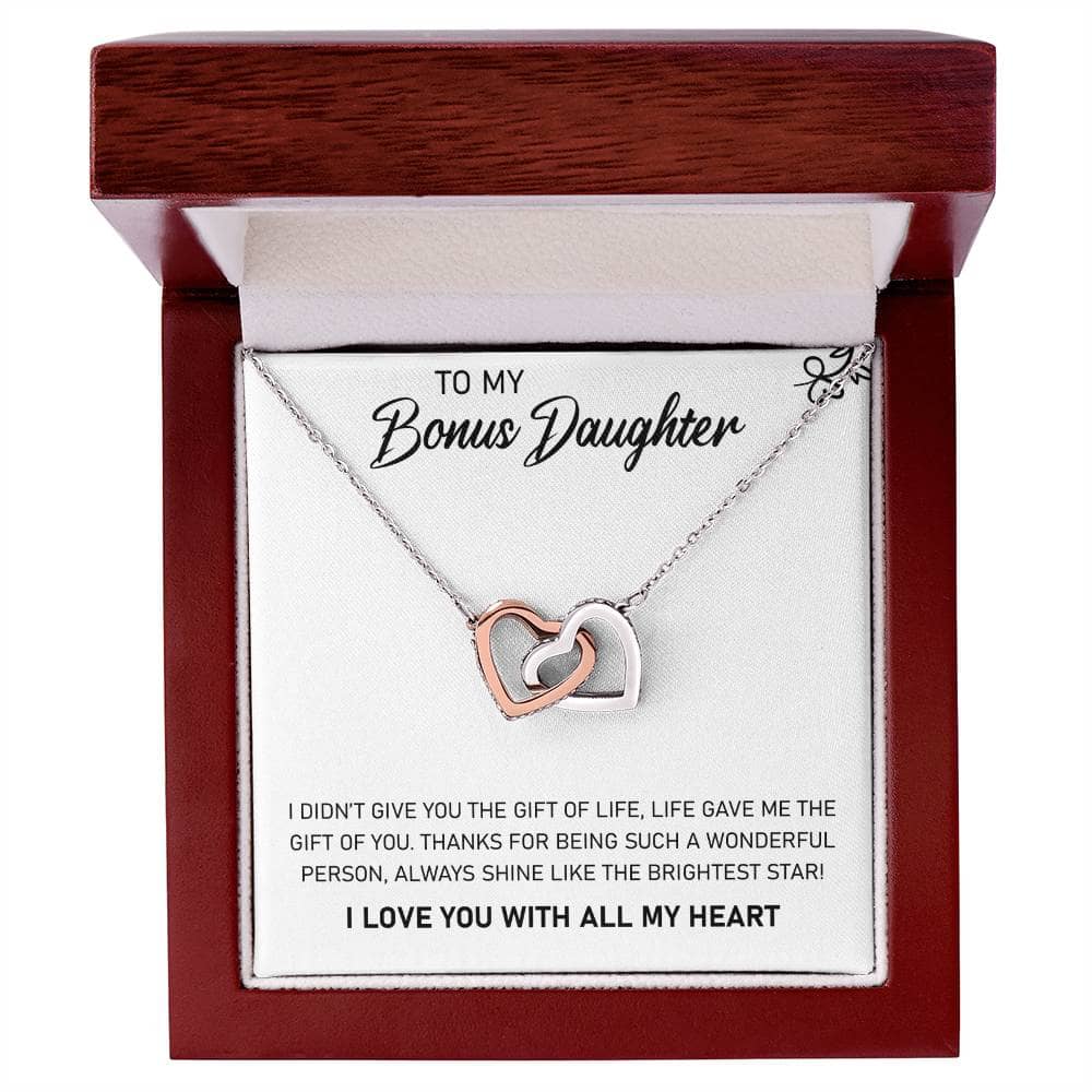 Alt text: "Personalized Daughter Necklace - Delicate necklace in a box, adorned with heart-shaped pendants and cubic zirconia, symbolizing the bond between a parent and a daughter."