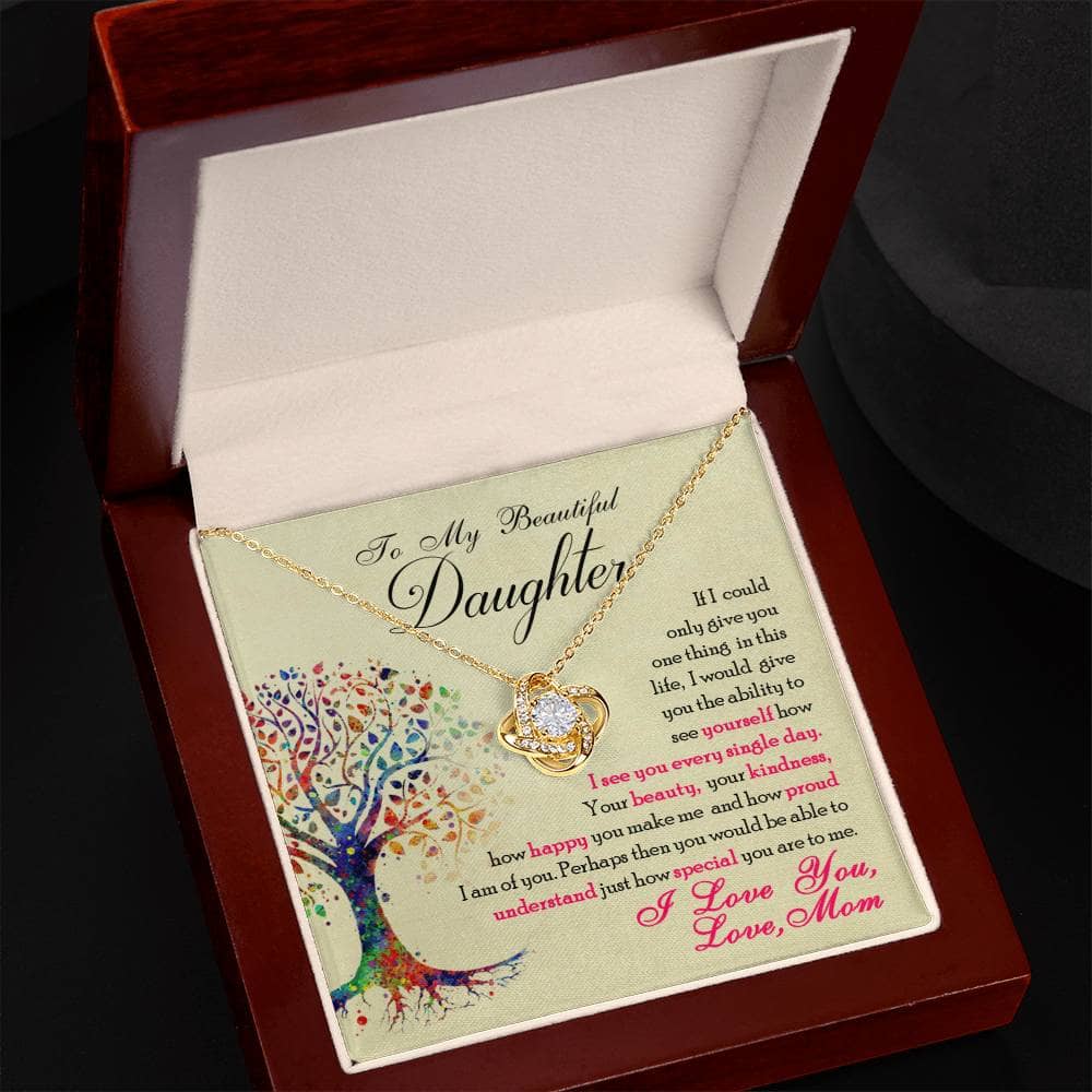 Alt text: "Personalized Daughter Necklace: Elegant Love Knot Design in a box, featuring a shimmering cubic zirconia pendant on an adjustable chain. Perfect for expressing love and celebrating special occasions. From Bespoke Necklaces."