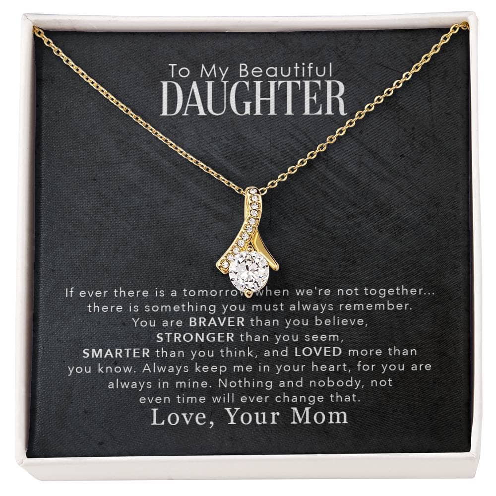 Alt text: "Personalized Daughter Necklace: A necklace in a box with a diamond pendant, symbolizing the enduring bond between parents and daughters."