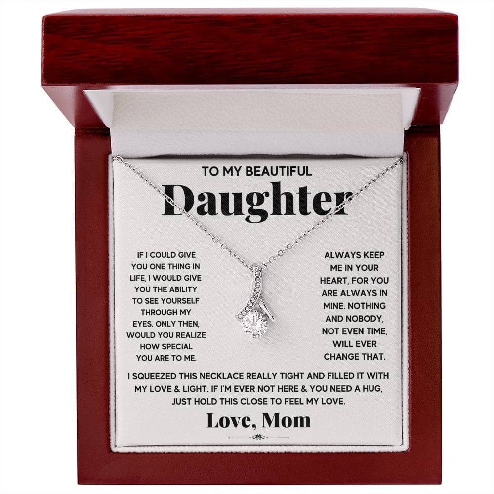 Alt text: "Personalized Daughter Necklace - a necklace in a box with a diamond pendant, symbolizing the enduring bond between parent and daughter."