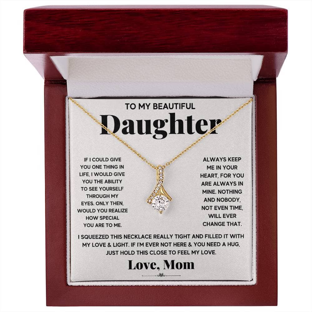 Alt text: "Personalized Daughter Necklace - a necklace with a diamond pendant in a box, symbolizing the enduring bond between parent and daughter"