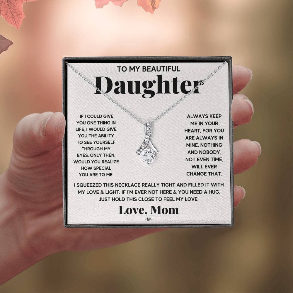 Alt text: "Hand holding Personalized Daughter Necklace - Elegant Symbol of Parental Love with diamond pendant"