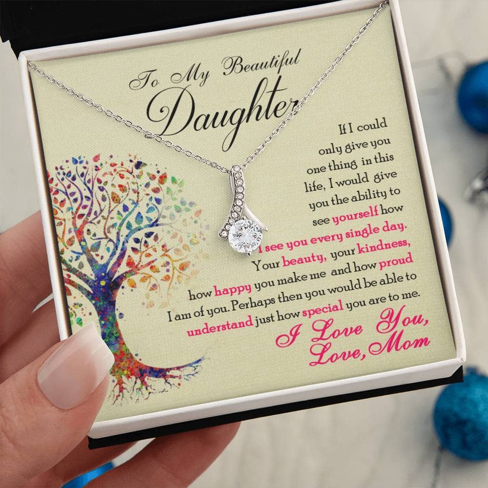 Alt text: "Hand holding a Personalized Daughter Necklace in a box, symbolizing a heartfelt bond tribute. Dazzling cubic zirconia pendant on an adjustable chain. Luxurious mahogany-style box with LED lighting. Perfect for gifting and celebrating love. From Bespoke Necklace."