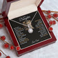 Alt text: "Personalized Daughter Necklace - a heart-shaped pendant in an elegant box with red berries"