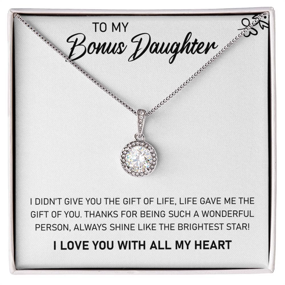 A close-up image of a personalized daughter necklace with a heart-shaped pendant and a dazzling cushion-cut cubic zirconia crystal.
