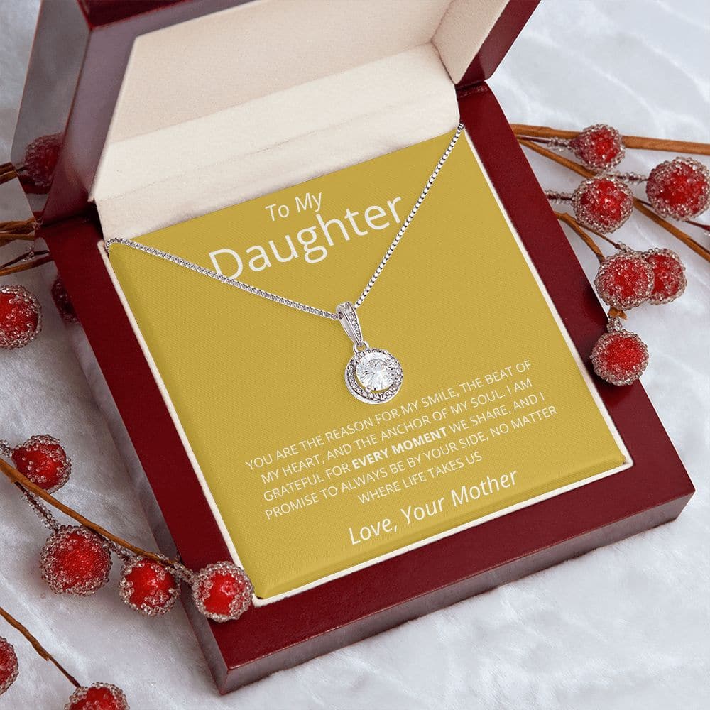 Alt text: "Personalized Daughter Necklace - a necklace in a box with red berries, symbolizing unbreakable bond and limitless love, from Bespoke Necklace"