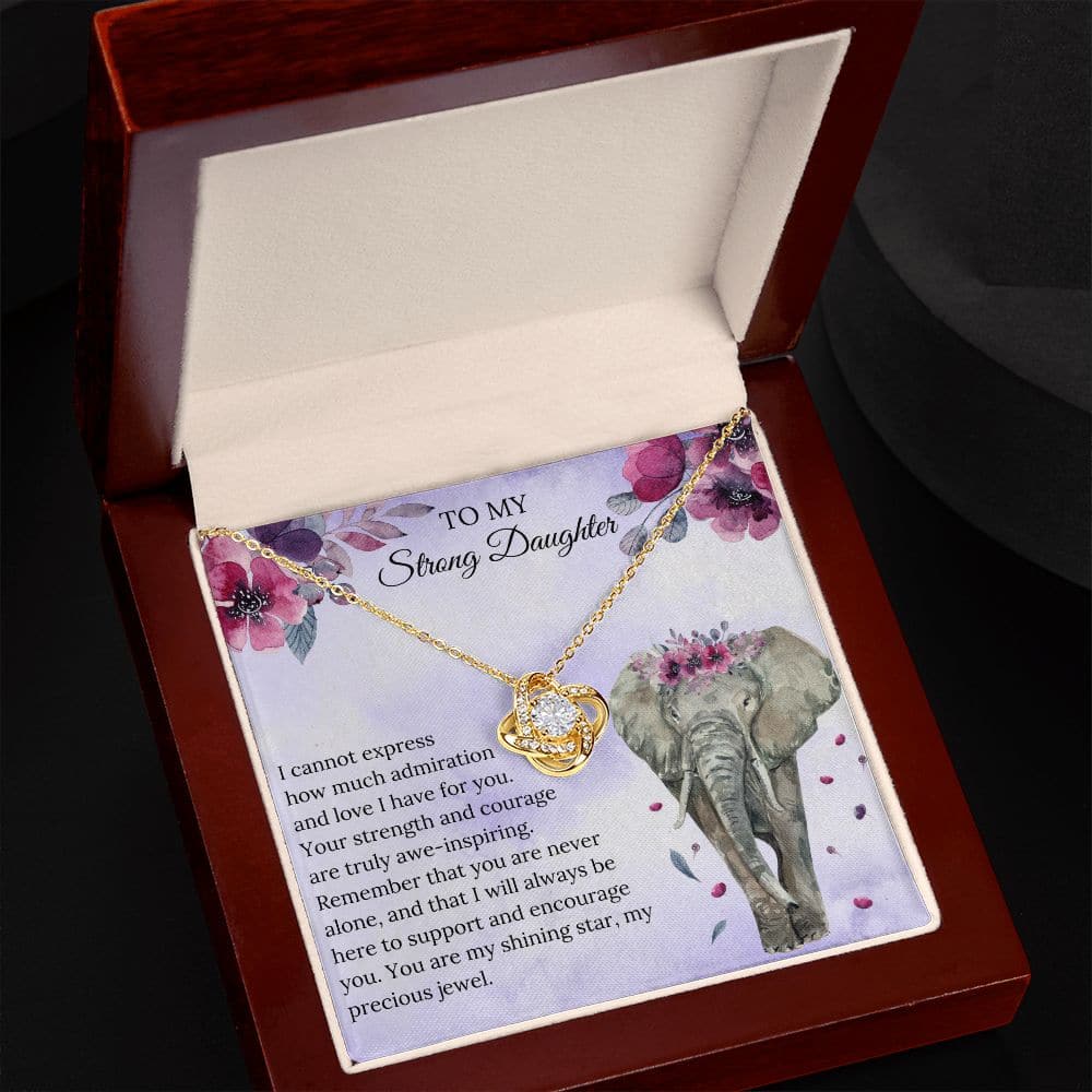 A handcrafted necklace in a mahogany-style box with LED lighting, featuring a heart-shaped pendant adorned with a cushion-cut cubic zirconia. Perfect for parents to gift their daughters as a symbol of enduring love.