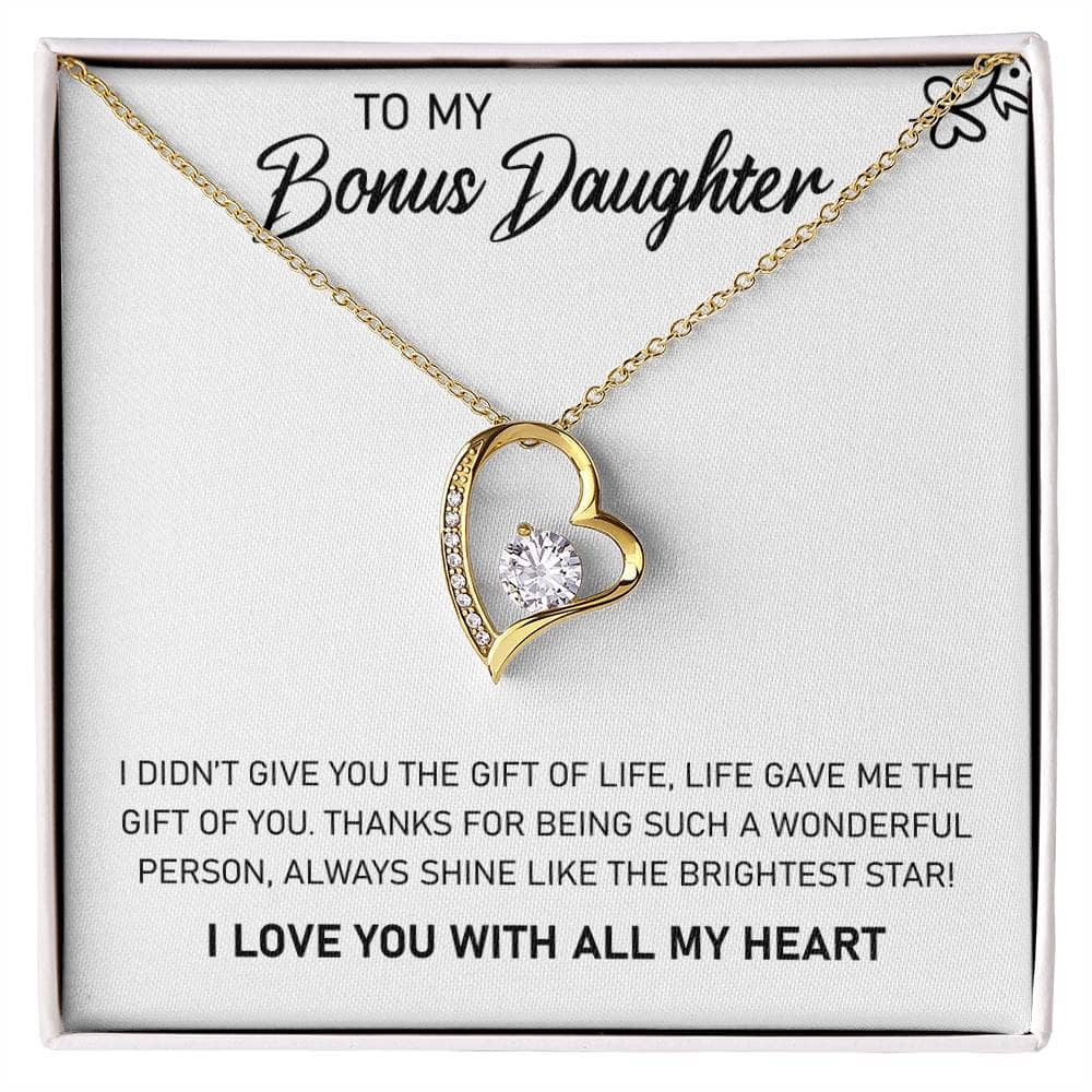 A gold necklace with a heart-shaped pendant in a box, symbolizing unbreakable parent-daughter bonds.