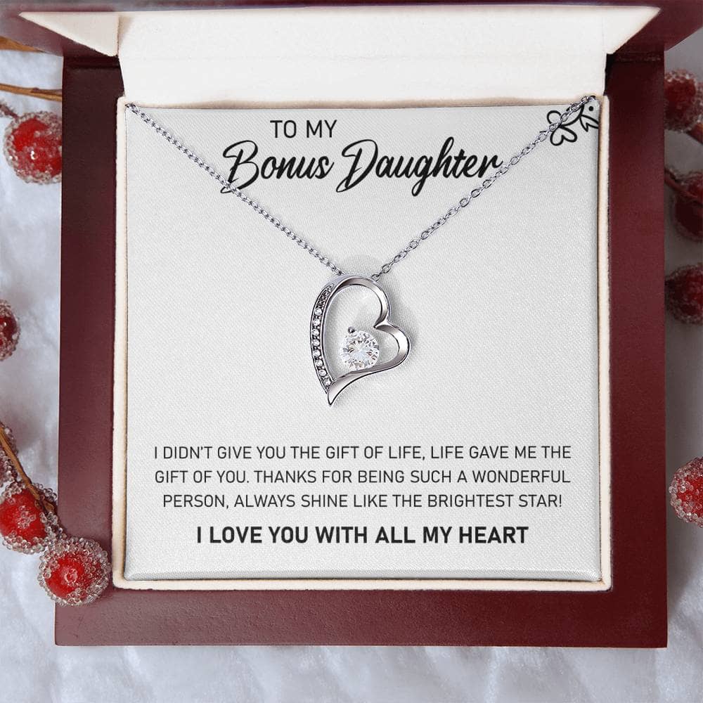 Alt text: "Personalized Daughter Necklace - A heart-shaped pendant with a sparkling cubic zirconia, presented in a mahogany-styled box."