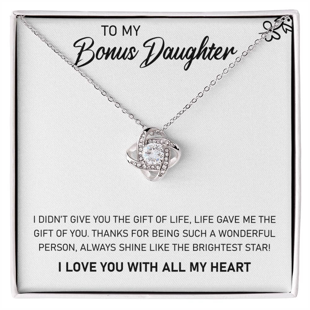 A close-up of a personalized daughter necklace in a box, featuring a heart-shaped pendant with a cushion-cut cubic zirconia.