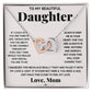 A necklace with two interlocking hearts, symbolizing the eternal bond between a parent and their daughter.