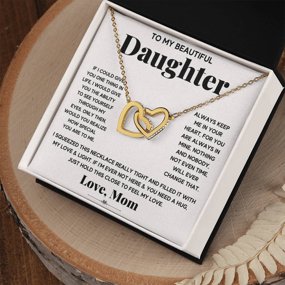 A personalized necklace with interlocking hearts, symbolizing the eternal bond between a parent and their daughter.