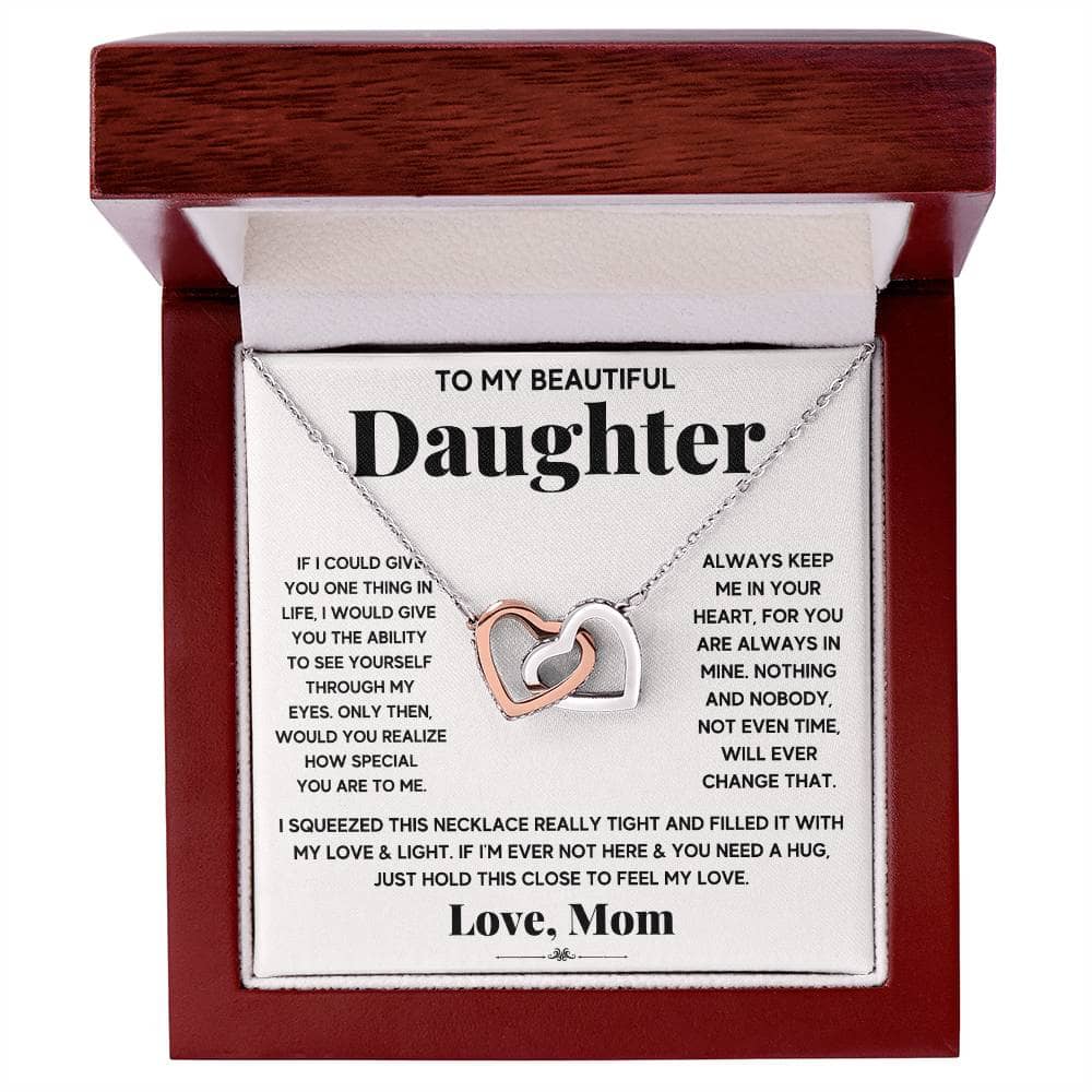 A personalized necklace with interlocking hearts, symbolizing the unbreakable bond between a parent and their daughter.