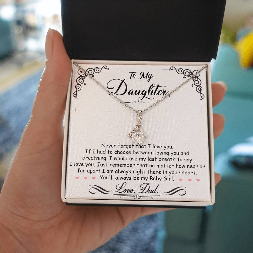 A hand holding a personalized Daughter Necklace: Love Bond in a luxury box.