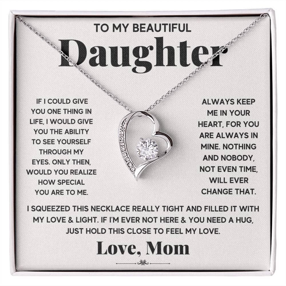 Alt text: "A necklace with a heart-shaped pendant in a box, symbolizing unbreakable bonds between parents and daughters."