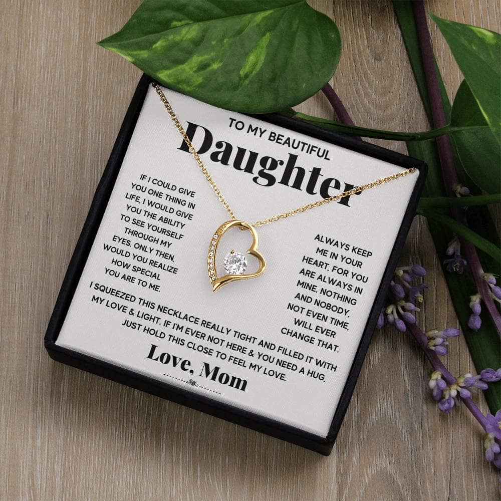 A necklace with a heart pendant on a chain, symbolizing the unbreakable bond between parents and daughters.