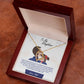 Alt text: "Personalized Daughter Necklace: Gold heart pendant in a box, symbolizing parental love and care. Adjustable chains for comfort. Luxurious packaging with LED spotlight. Perfect gift for milestones and special occasions."