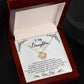 A personalized Daughter Necklace featuring a glimmering cubic zirconia Love Knot pendant. Comes in a luxurious mahogany-style box with LED lighting.