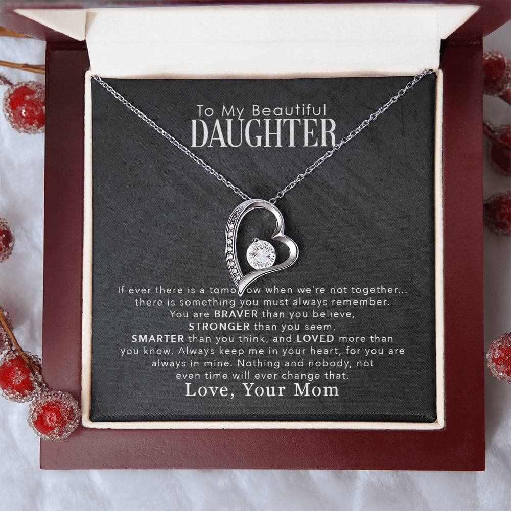 A close-up of a heart-shaped pendant on a Personalized Daughter Necklace, elegantly packaged in a mahogany-style luxury box with LED lighting.