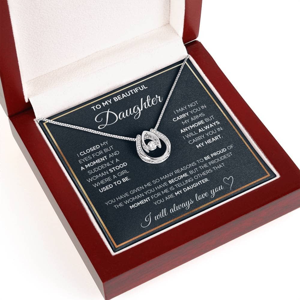 A close-up of a personalized daughter necklace in a box, symbolizing love and bond.