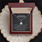 Alt text: "Personalized Daughter Necklace - a necklace in a box on a plate, symbolizing love and strength"