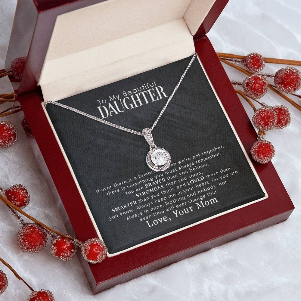 Alt text: "Personalized Daughter Necklace in mahogany box with red berries"
