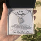 Alt text: "A hand holding a personalized daughter necklace with a heart-shaped pendant in a box, symbolizing an unbreakable bond of love and care. Presented in an opulent mahogany-style box with LED backlighting, creating a memorable unboxing experience."