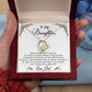 Alt text: "Hand holding personalized Daughter Necklace in mahogany-style box with LED lighting"