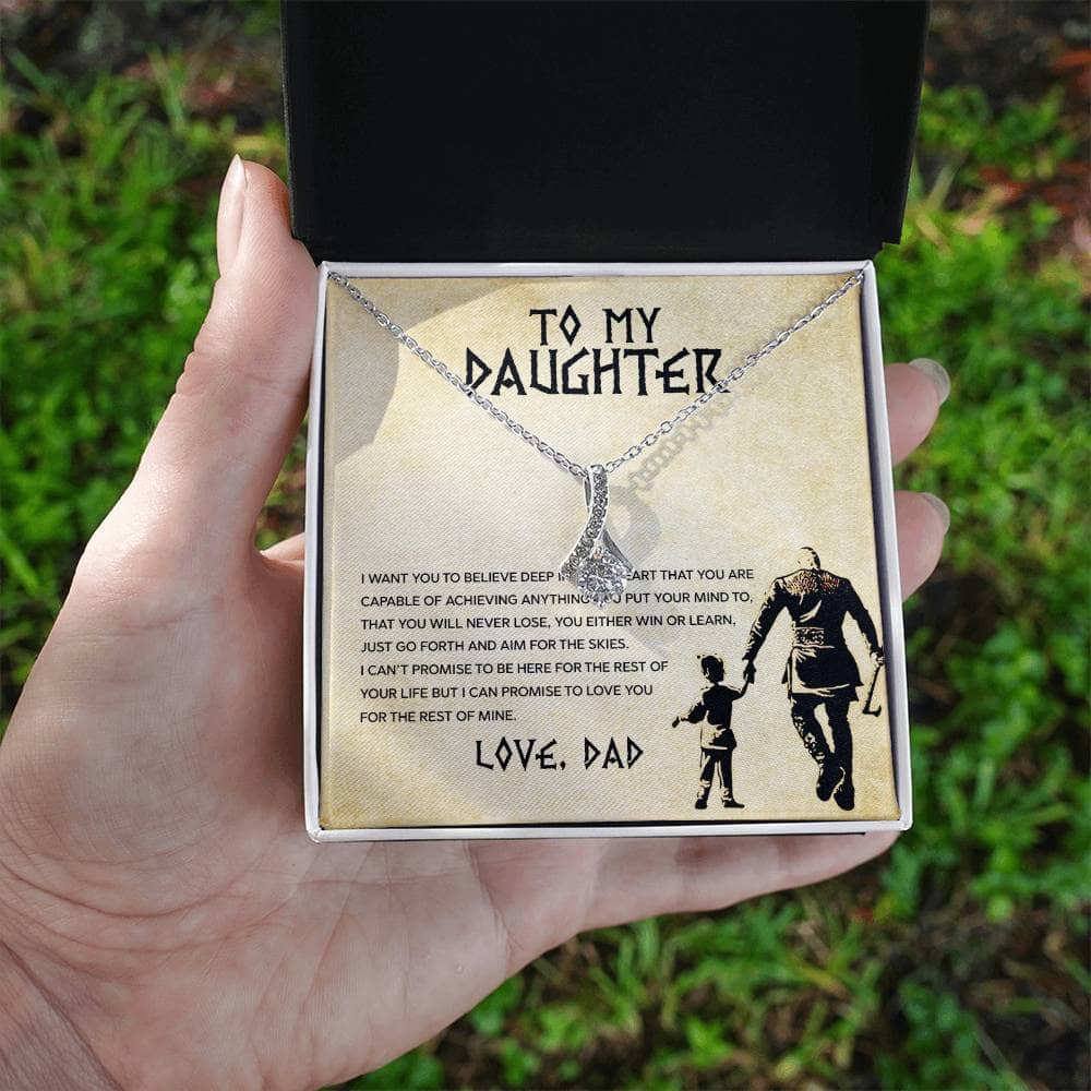 Alt text: A hand holding a Personalized Daughter Necklace, a symbol of love and connection, adorned with a heart-shaped pendant, packaged in a mahogany-like box with LED lighting.